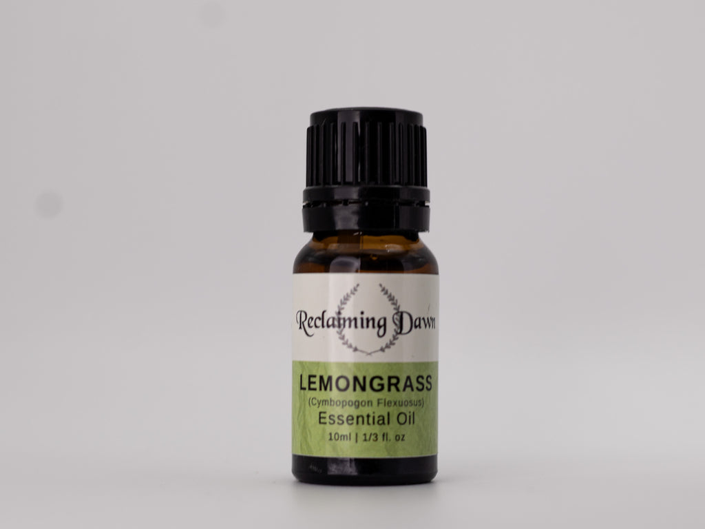 Bottle of Reclamimg Dewars Lemongrass essential oil on a gray background