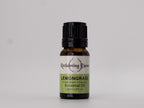 Bottle of Reclamimg Dewars Lemongrass essential oil on a gray background