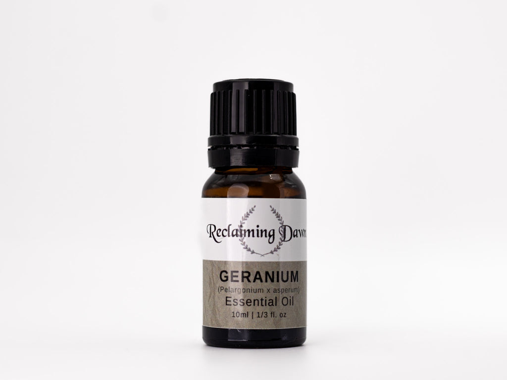Bottle of Reclamimg Darma Geranium essential oil on a white background