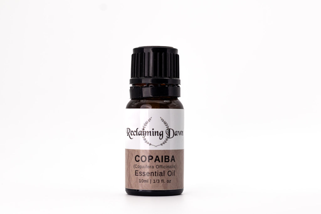 Bottle of Copaiba essential oil with a white background