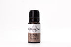 Bottle of Copaiba essential oil with a white background