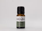 Tea tree essential oil bottle with 'Reclaiming Dawn' label on a white background