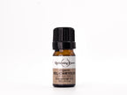 Bottle of Helichrysum essential oil with a white label on a white background