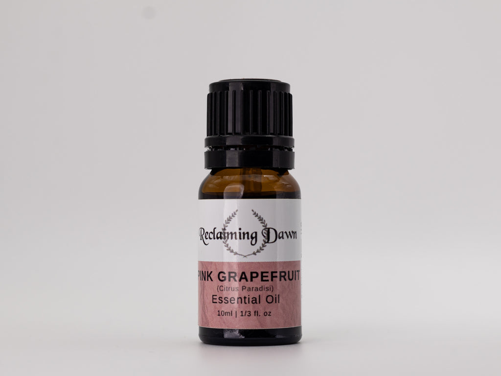 Bottle of Pink Grapefruit essential oil with a label on a white background