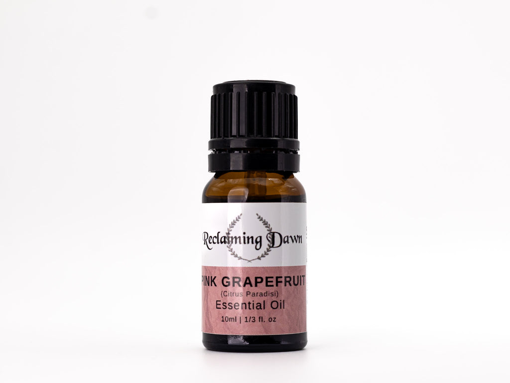Bottle of Pink Grapefruit essential oil with a black cap on a white background