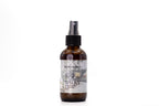 Room spray bottle with label on a white background