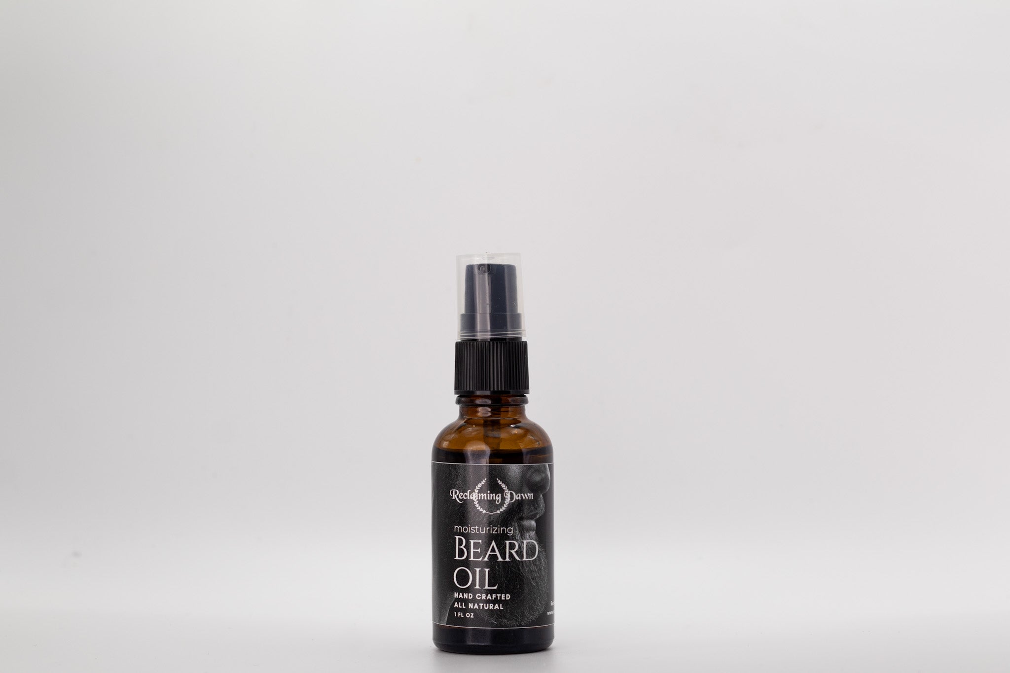Bottle of beard oil with a black label on a white background